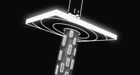 a black and white photo of a street light